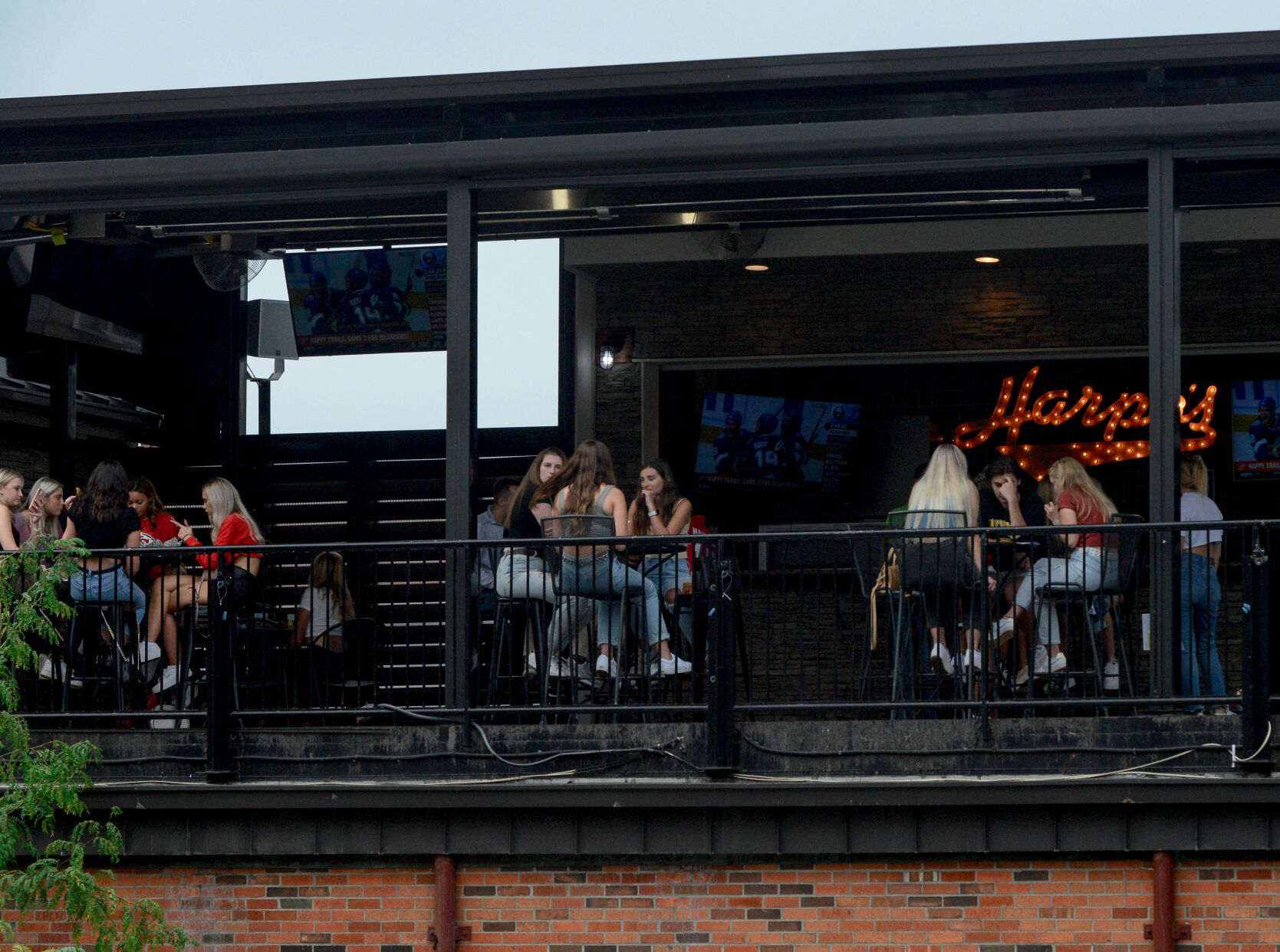 Customers sit outside on the patio of Harpo's on Thursday